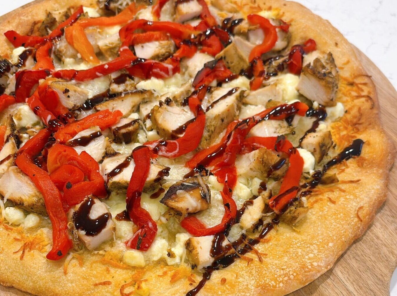 Mediterranean Grilled Chicken and Roasted Red Pepper Pizza with Feta and Balsamic Glaze