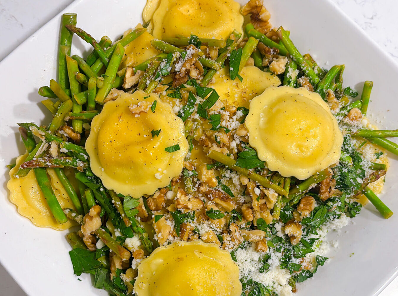 Ravioli with Sauteed Asparagus and Walnuts