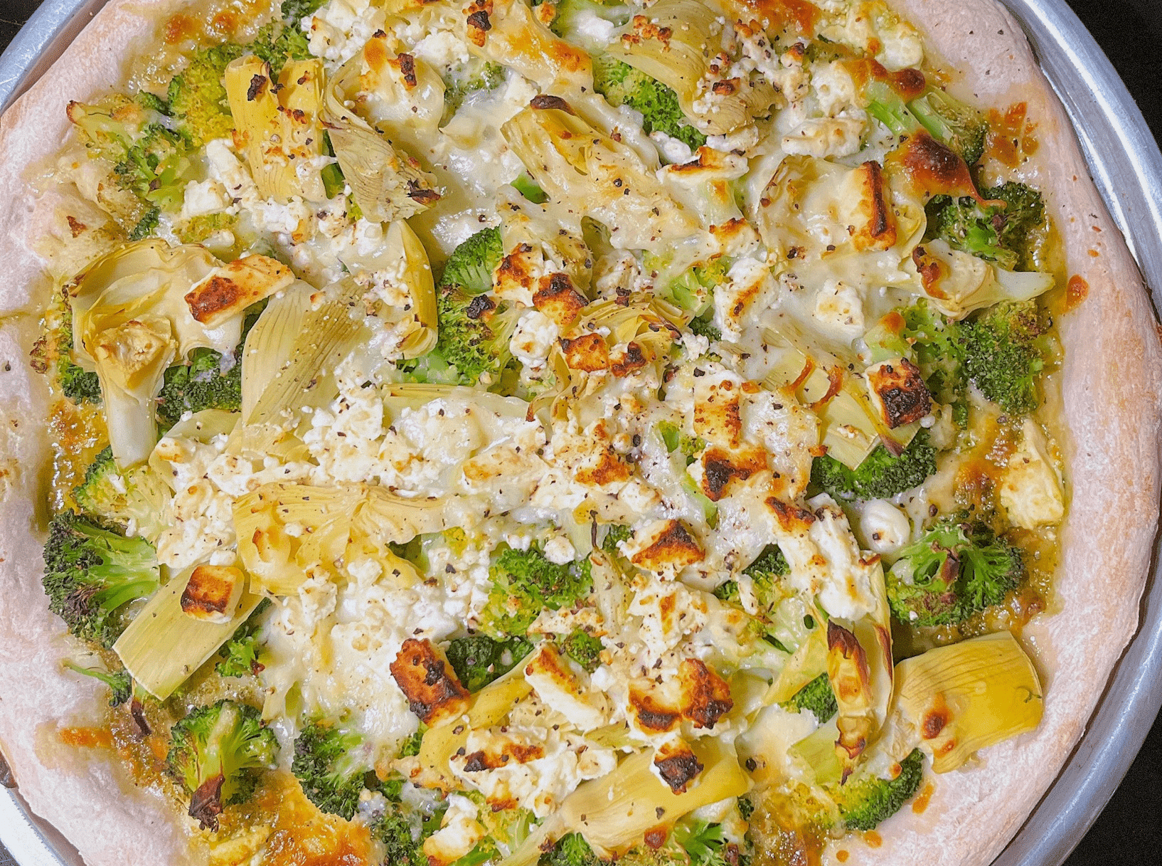 Green Pizza with Pesto, Feta, Artichokes, and Broccoli