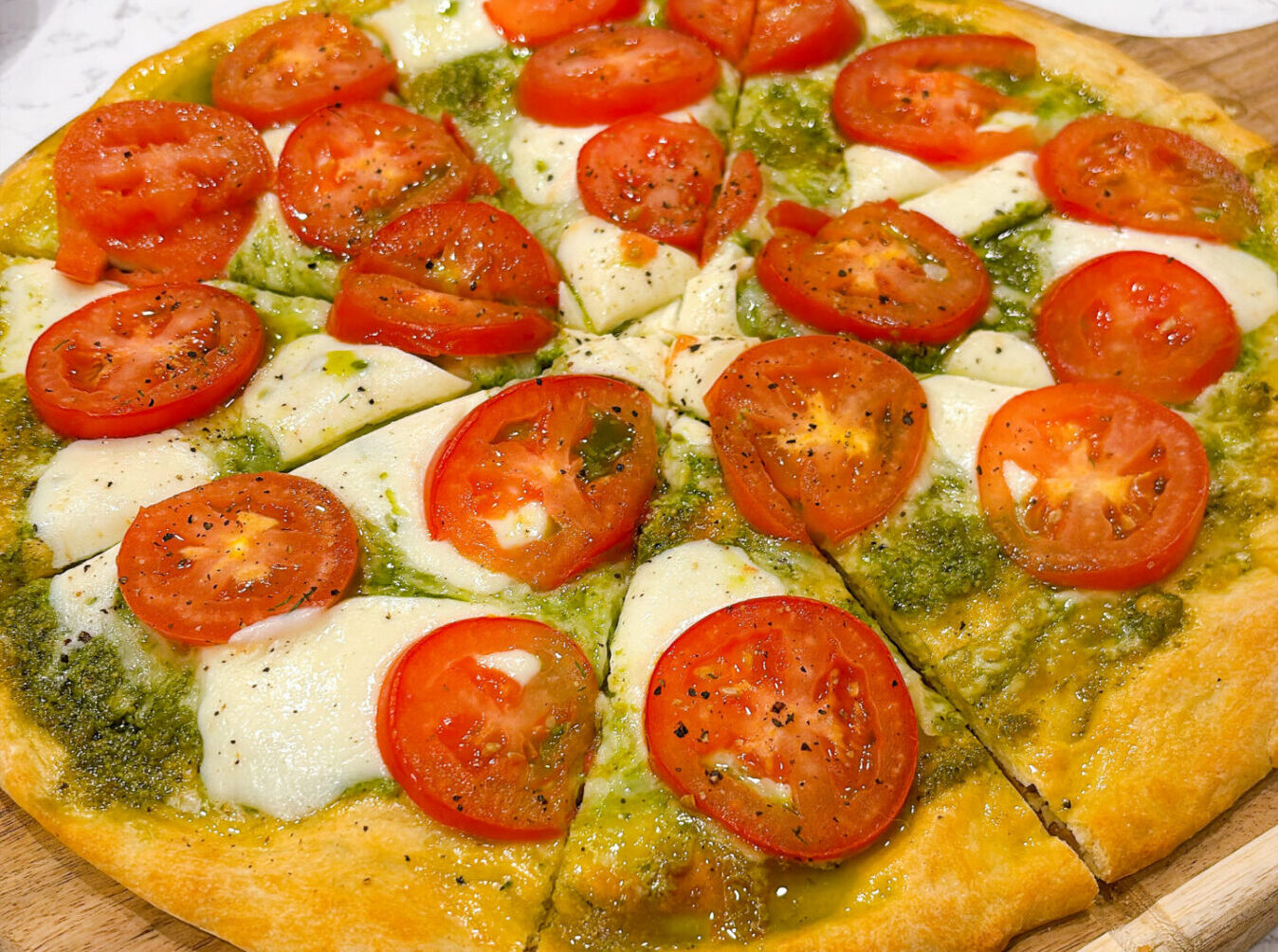 Pizza with Pesto, Fresh Tomatoes, and Mozzarella